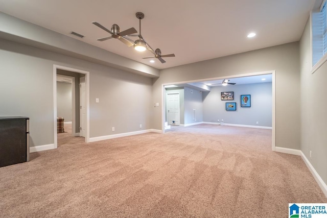 interior space with light carpet, baseboards, a ceiling fan, and recessed lighting