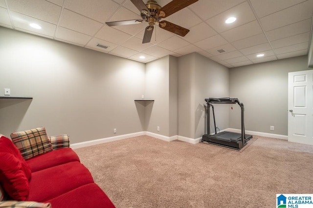 interior space with carpet, visible vents, ceiling fan, and baseboards