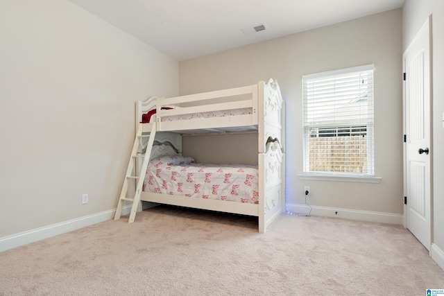 bedroom featuring visible vents, baseboards, and carpet floors