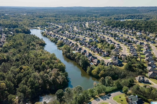 bird's eye view featuring a residential view, a forest view, and a water view