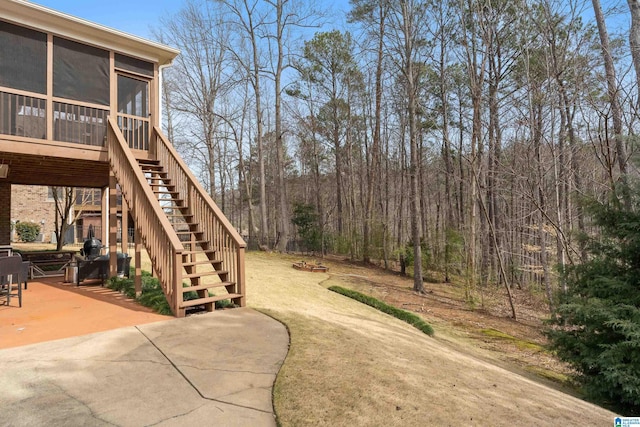 1401 Haddon Pl, Hoover, AL 35226 - view of yard featuring stairway, a sunroom, a patio, and a fire pit