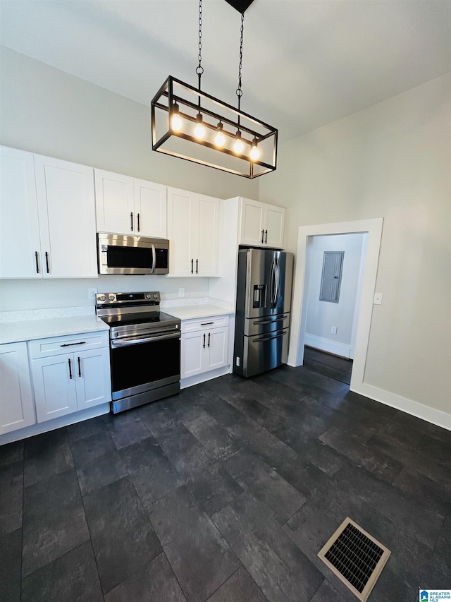 kitchen featuring visible vents, baseboards, light countertops, appliances with stainless steel finishes, and white cabinets