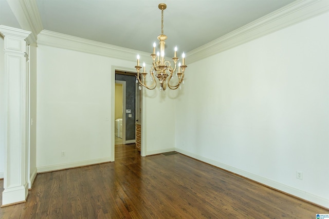 unfurnished room with dark wood-style floors, decorative columns, an inviting chandelier, ornamental molding, and baseboards