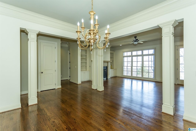 unfurnished dining area with ornate columns and a fireplace