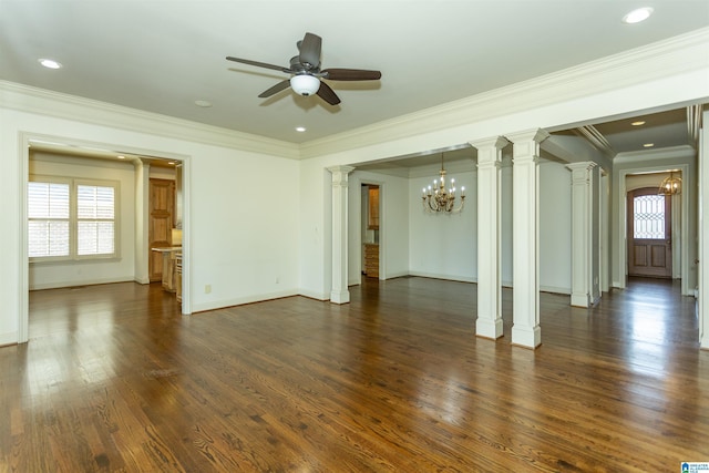 unfurnished room with dark wood-style floors, a wealth of natural light, ceiling fan with notable chandelier, and decorative columns