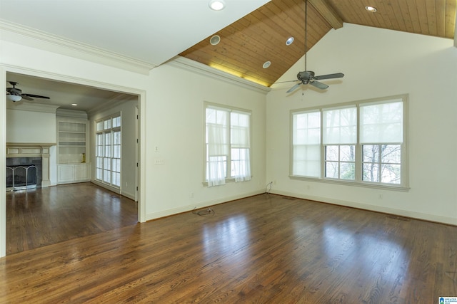 unfurnished living room featuring a fireplace, ornamental molding, wood finished floors, beamed ceiling, and baseboards