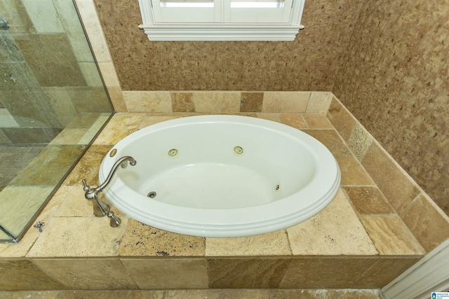 bathroom featuring a whirlpool tub