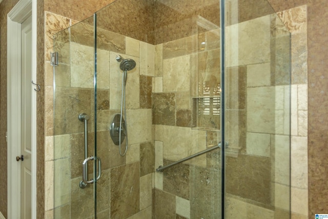 bathroom featuring a shower stall