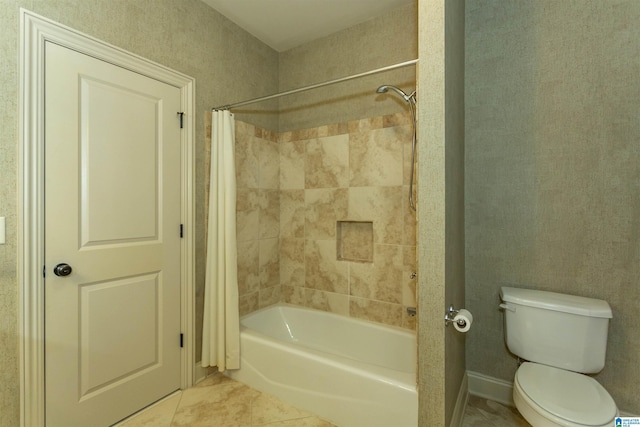 full bath featuring tile patterned flooring, shower / tub combo with curtain, and toilet