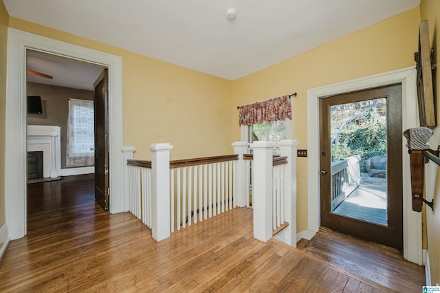 interior space featuring an upstairs landing and hardwood / wood-style flooring