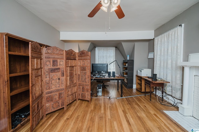 home office featuring a ceiling fan and hardwood / wood-style floors