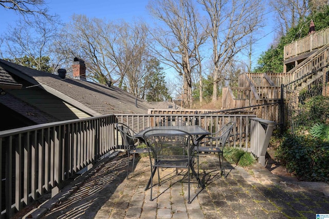 view of patio featuring stairs and outdoor dining area