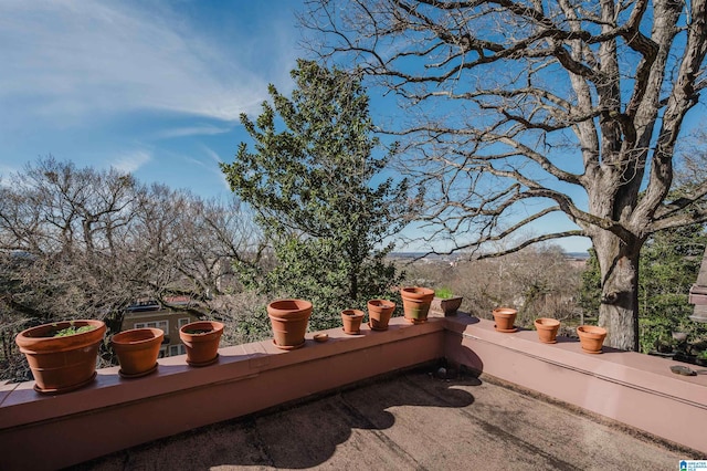 wooden terrace with a patio