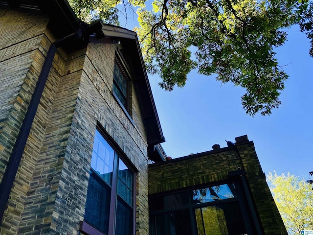 view of home's exterior featuring brick siding