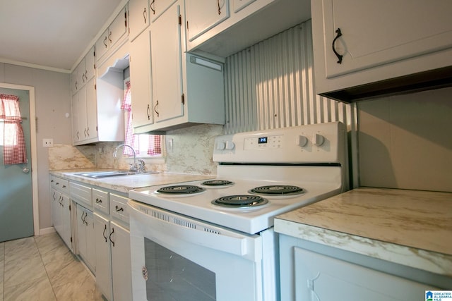 6355 Swann Rd, Mount Olive, AL 35117 - kitchen with a sink, white electric range, marble finish floor, light countertops, and white cabinets