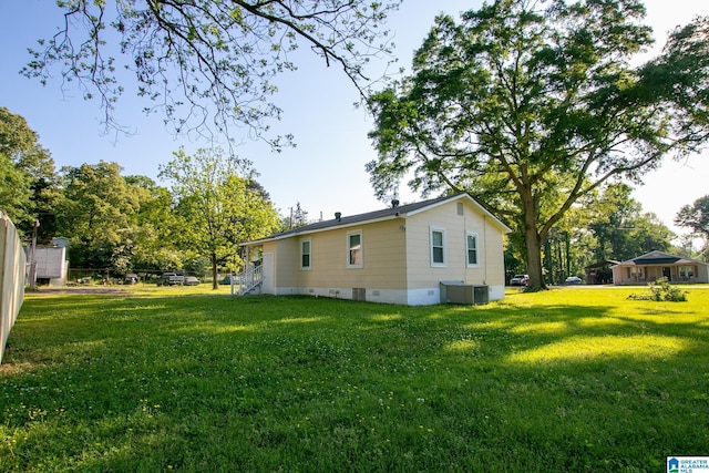 6355 Swann Rd, Mount Olive, AL 35117 - view of side of property with crawl space, central AC unit, and a lawn