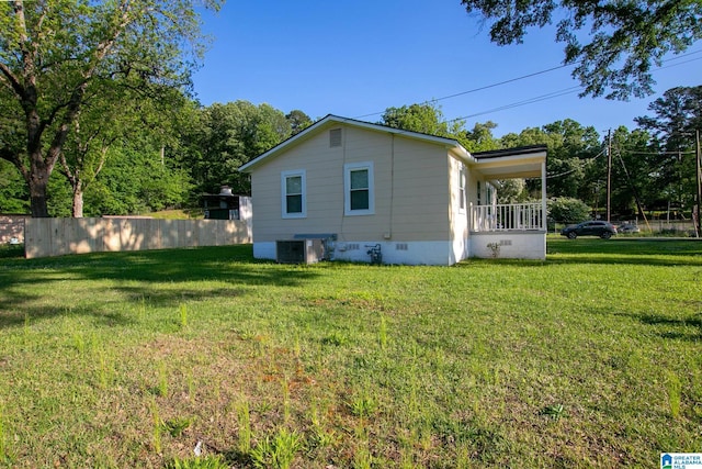 6355 Swann Rd, Mount Olive, AL 35117 - view of side of home with a lawn, fence, central AC, and crawl space