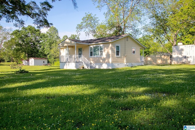 6355 Swann Rd, Mount Olive, AL 35117 - rear view of property featuring an outdoor structure, a yard, and crawl space