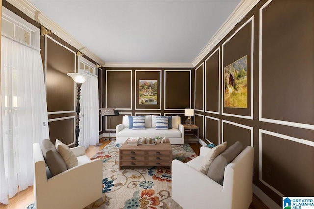 bedroom with ornamental molding, a decorative wall, and wood finished floors