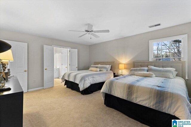 bedroom featuring ceiling fan, connected bathroom, visible vents, baseboards, and carpet