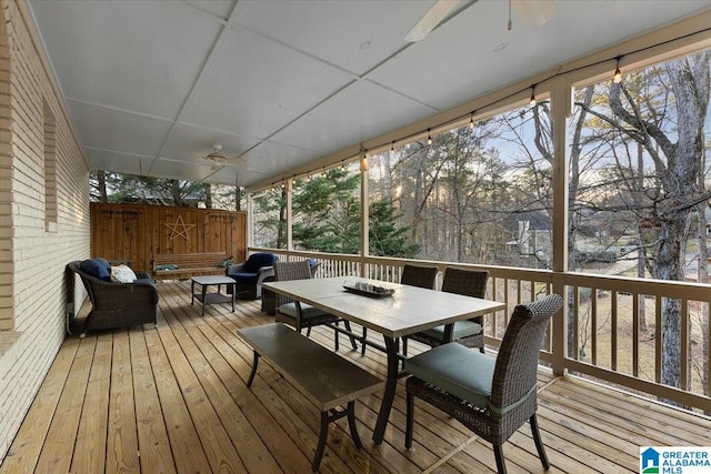 wooden deck with outdoor dining area and an outdoor living space