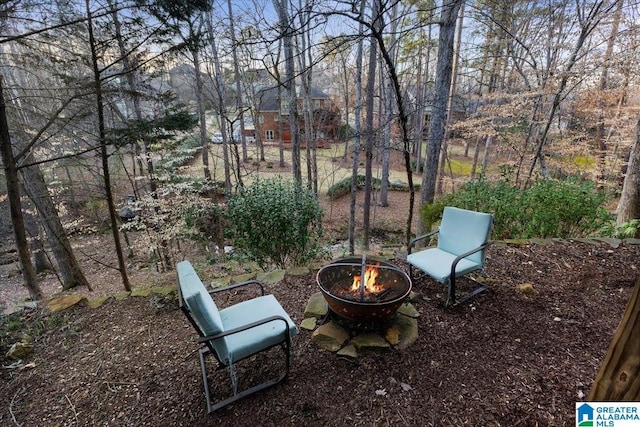 view of patio / terrace with a fire pit