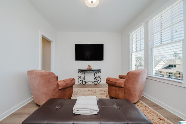 living room with wood finished floors and baseboards