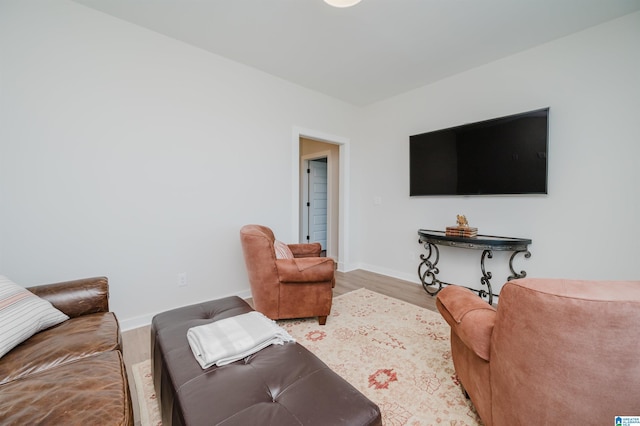 living room featuring wood finished floors and baseboards