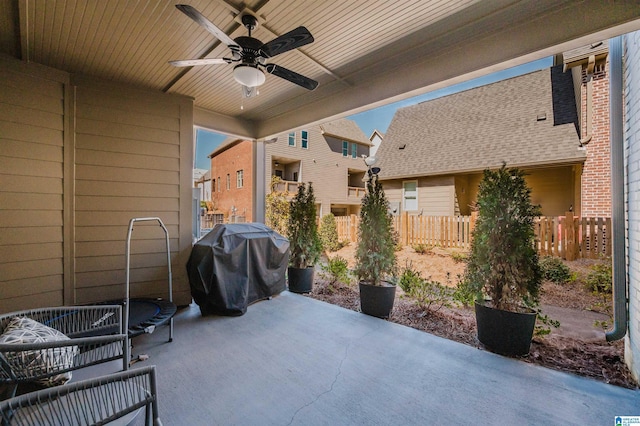 view of patio / terrace with ceiling fan, a grill, and fence