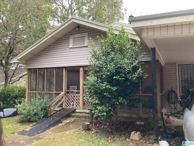 view of front of property with a sunroom