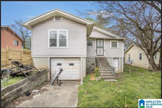 view of front of home with a front lawn, fence, stairway, driveway, and an attached garage