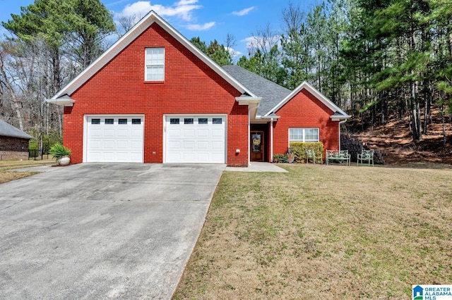 traditional-style house with a front lawn, brick siding, a garage, and driveway