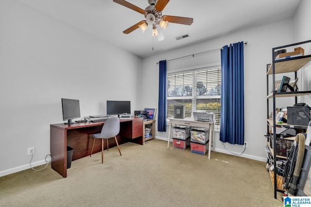 home office featuring visible vents, baseboards, carpet, and ceiling fan