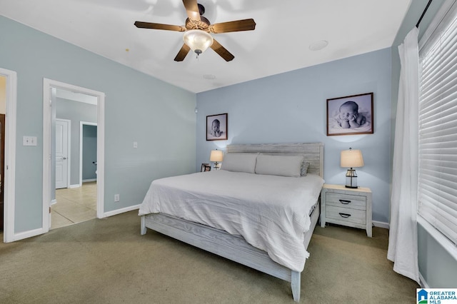 bedroom with carpet flooring, a ceiling fan, and baseboards