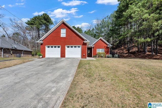 view of front of property with brick siding, cooling unit, driveway, and a front yard