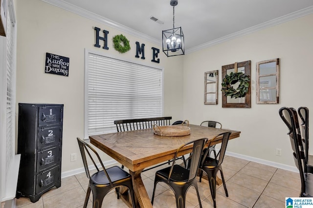 dining room featuring an inviting chandelier, crown molding, light tile patterned floors, and baseboards