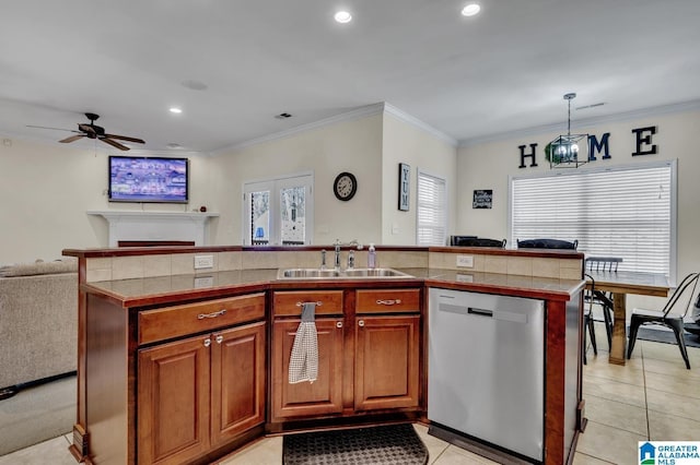 kitchen with a sink, open floor plan, crown molding, dishwasher, and ceiling fan