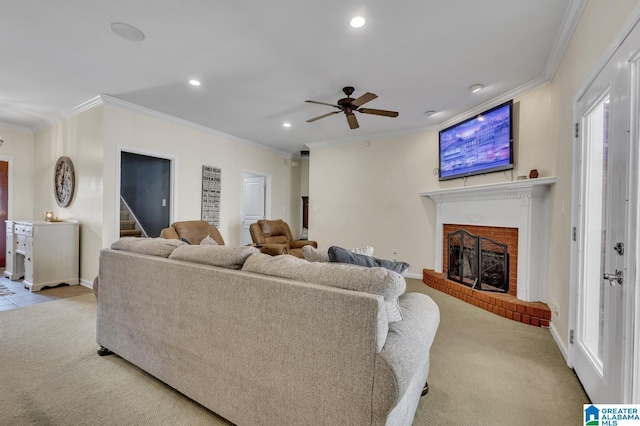 carpeted living area with recessed lighting, a fireplace, ceiling fan, and ornamental molding