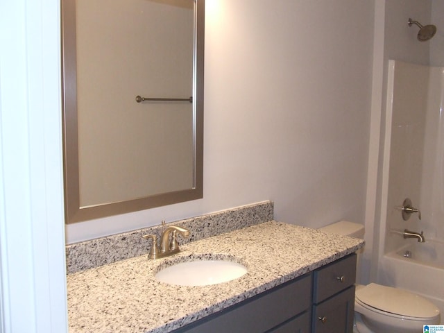 bathroom with toilet, bathtub / shower combination, and vanity