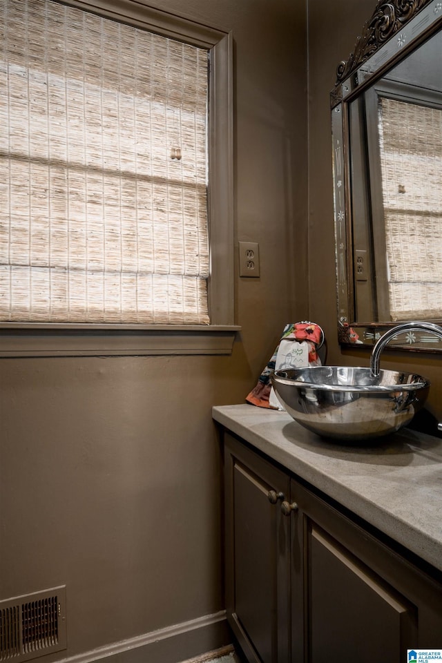 bathroom with visible vents and vanity