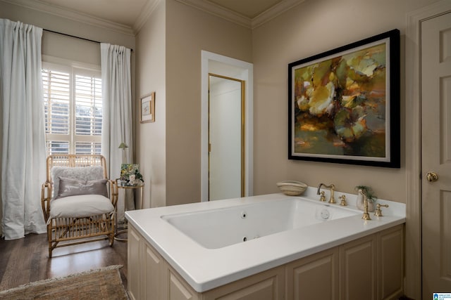 full bath featuring a whirlpool tub, wood finished floors, and ornamental molding