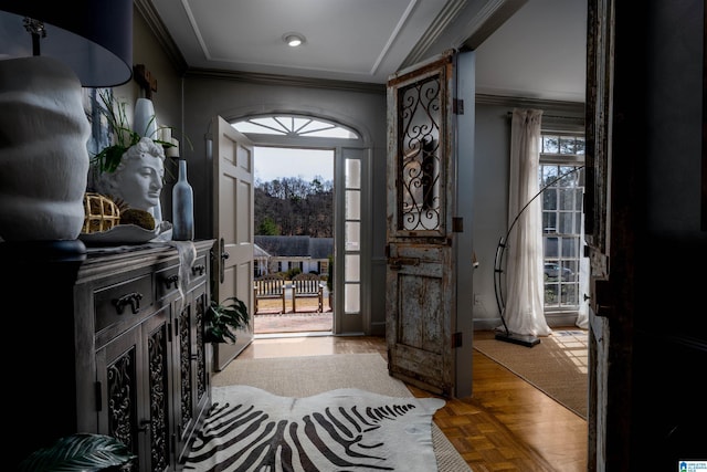 foyer featuring ornamental molding