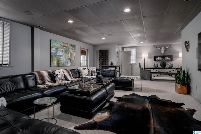 carpeted living area with recessed lighting, visible vents, and a drop ceiling