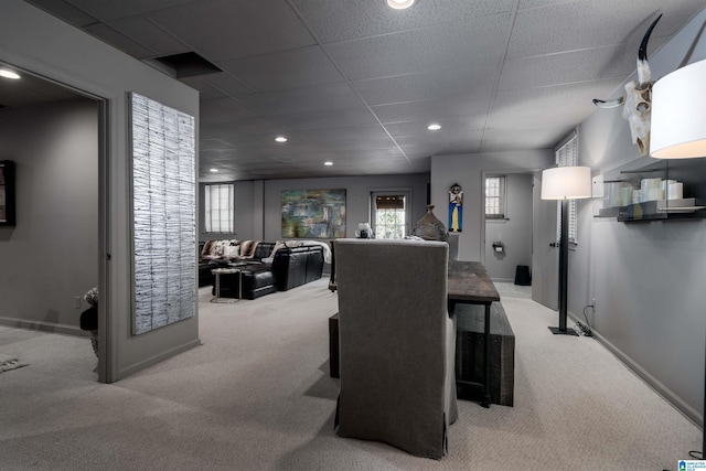 carpeted dining space with recessed lighting, baseboards, and a paneled ceiling