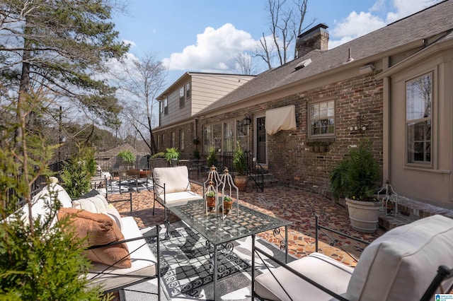 view of patio / terrace with an outdoor living space and fence