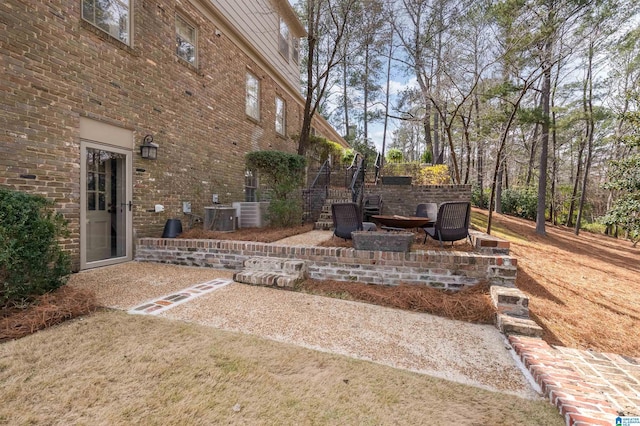 view of patio with a fire pit