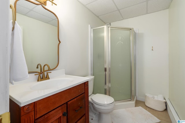 bathroom with tile patterned floors, a paneled ceiling, and a shower stall