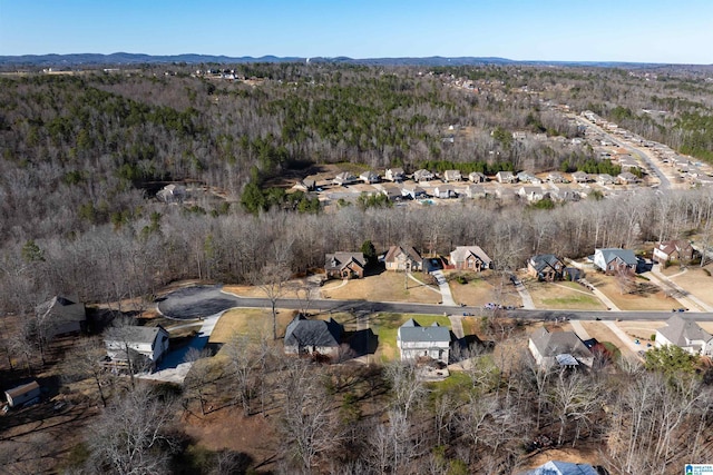 drone / aerial view with a residential view and a forest view