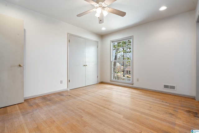 unfurnished bedroom featuring visible vents, a ceiling fan, recessed lighting, light wood-style floors, and baseboards