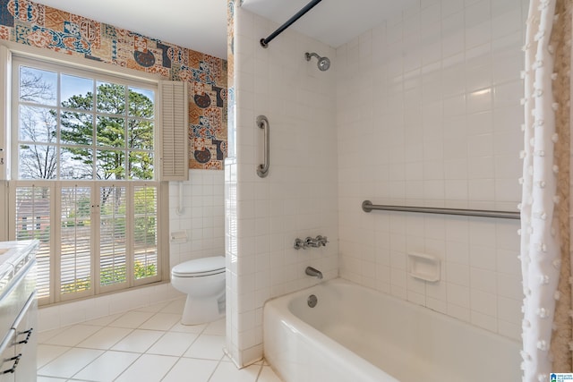 full bathroom featuring vanity, shower / bath combination with curtain, tile walls, toilet, and tile patterned floors